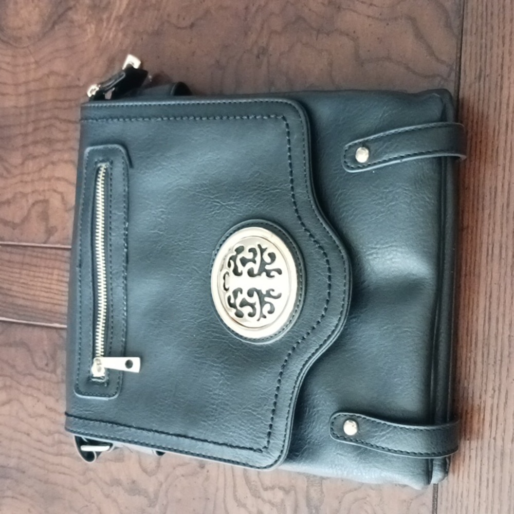 Black crossbody purse with gold detailing